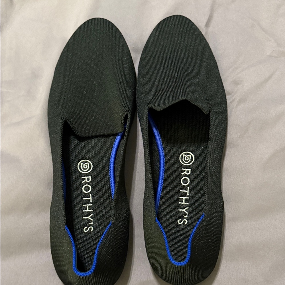Rothy's Women’s Black Slip-Ons with Blue Trim